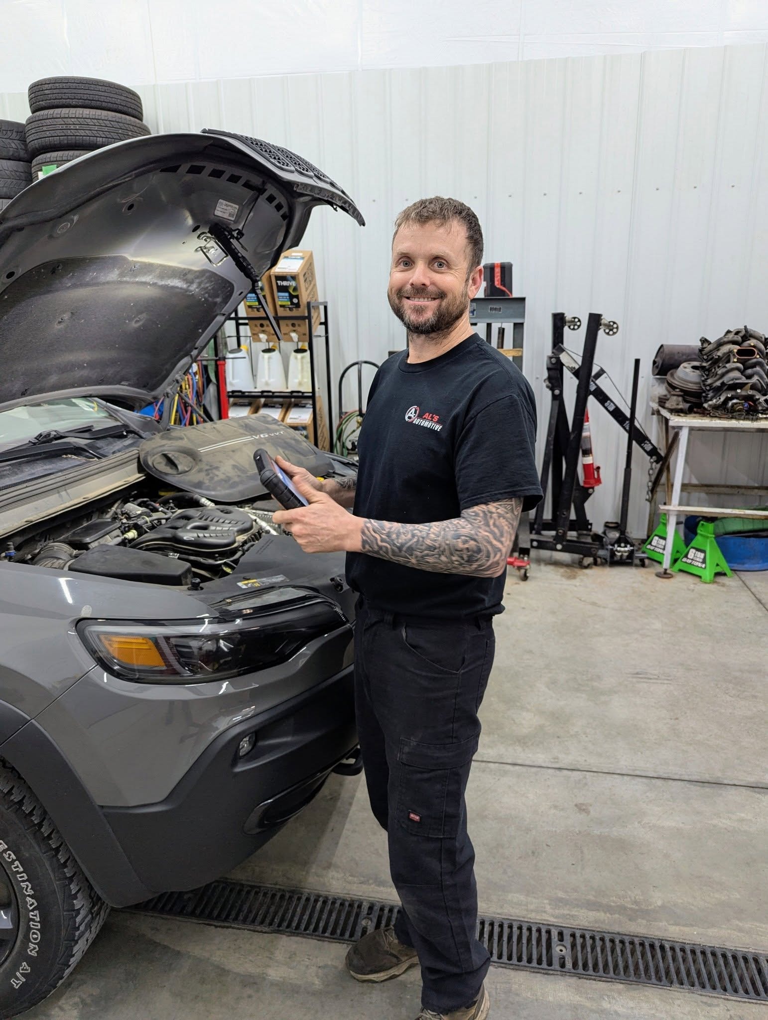 Mechanic using a vehicle diagnostic tool